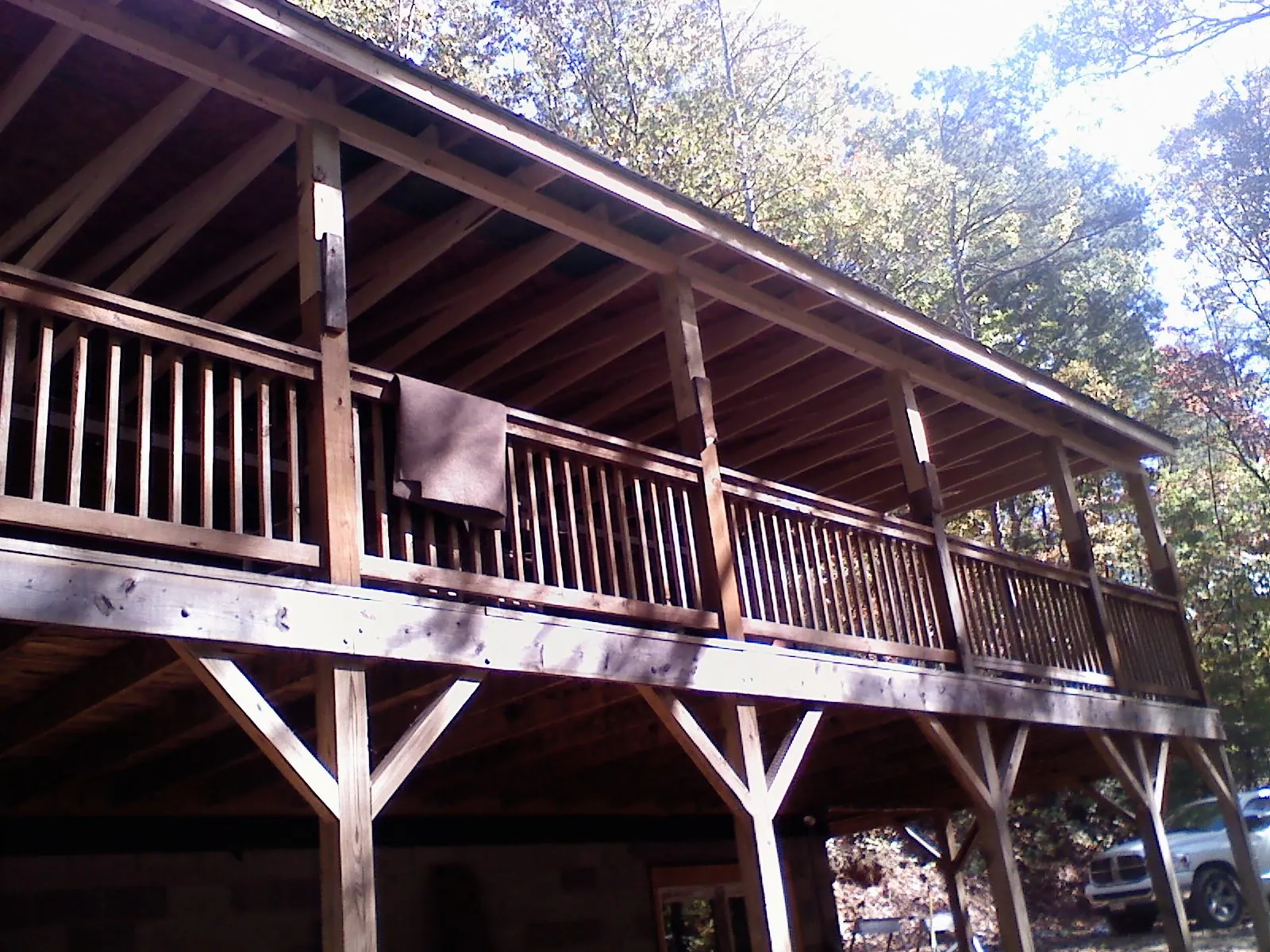 Timber framing under a new elevated porch and deck — Roof Leak Repair in Mill City by Roofing Brothers